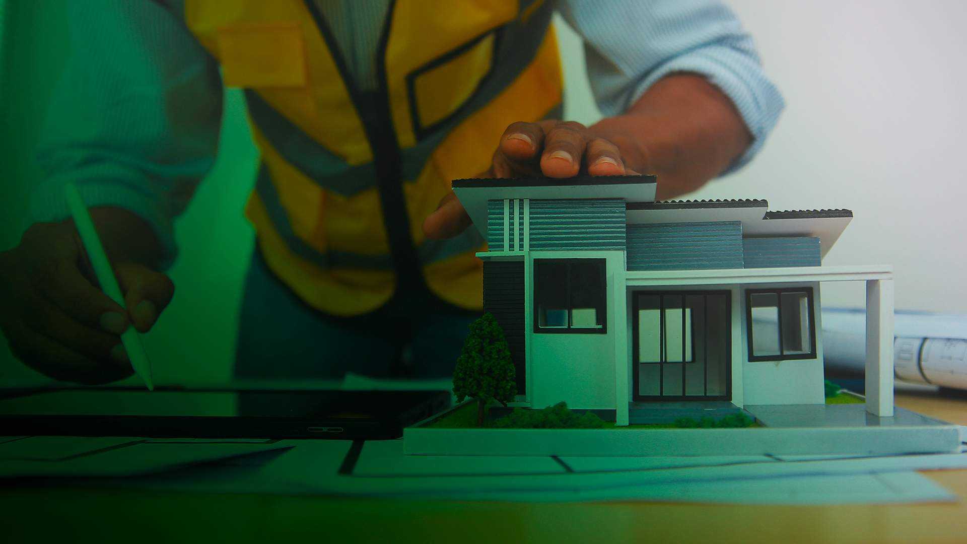Developer reviewing a model home and plans